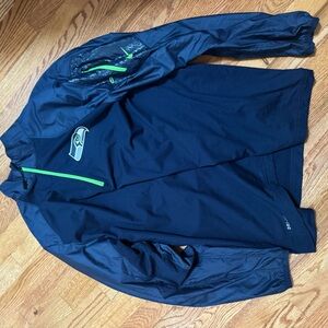 Nike Men's Dark Blue Windbreaker with Green Accents